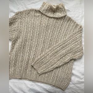 Women’s cream turtleneck sweater